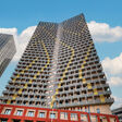 Der Q-Tower ist Teil des neuen Stadtteil-Projekts THE MARKS. Der „goldene Turm“ sticht mit goldenen Akzenten auf der Fassade hervor.