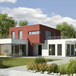 Modernes Wohnhaus mit drei Baubereichen, die äußeren beiden davon einstöckig und weiß, das mittlere zweistöckig und braun.