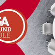 Das Logo des TGA Round Table: Weißer Schriftzug auf rotem Untergrund und ein runder Tisch auf der rechten Bildhälfte.