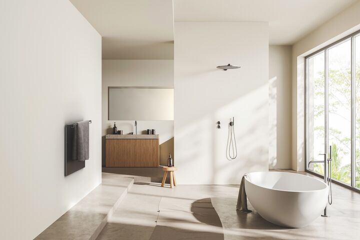 Beige bathroom interior with bathtub on light concrete floor. Sink with mirror, shower and towel rail ladder with accessories, panoramic window on tropics. 3D rendering