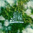 A city-shaped lake in the middle of a lush forest as a metaphor for eco-friendly urbanism and modern green living in general. 3D rendering.