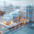 An aerial view of a digital twin of a tech factory, semi transparent that can view the interior of the factory. Generative AI.